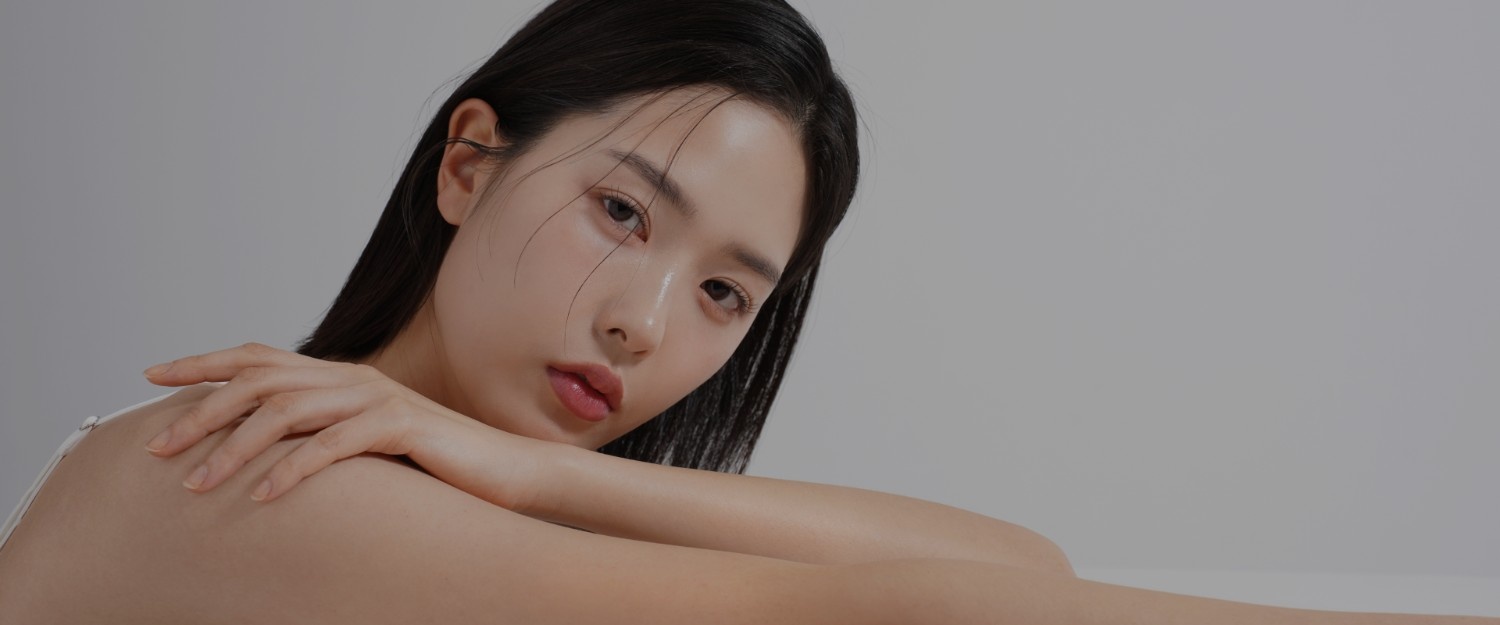 Woman with glowing skin representing premium skincare